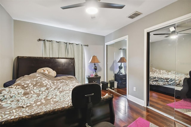 bedroom featuring dark wood-type flooring, ceiling fan, and a closet