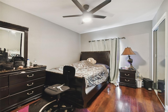 bedroom with ceiling fan and dark hardwood / wood-style floors