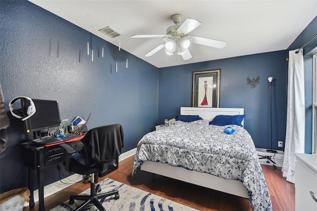 bedroom featuring dark wood-type flooring and ceiling fan