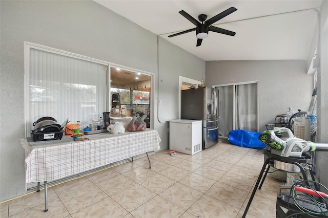 interior space with ceiling fan