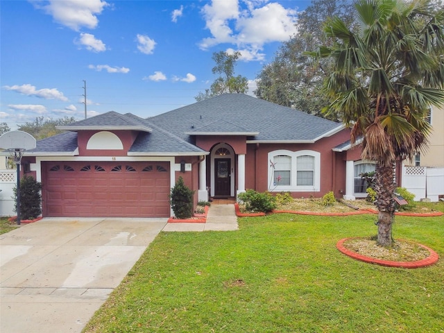 ranch-style house with a garage and a front lawn