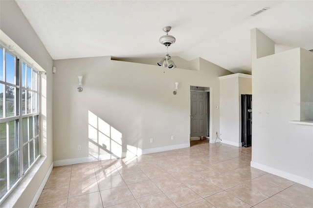 1053 E Hancock Dr, Deltona, FL 32725 - unfurnished room featuring lofted ceiling and light tile patterned flooring
