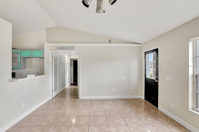 1053 E Hancock Dr, Deltona, FL 32725 - unfurnished room with lofted ceiling, ceiling fan, and light tile patterned flooring