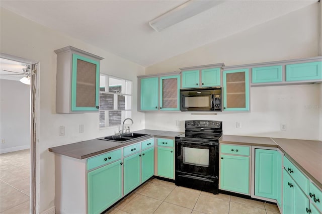 1053 E Hancock Dr, Deltona, FL 32725 - kitchen with black appliances, vaulted ceiling, light tile patterned floors, glass insert cabinets, and ceiling fan
