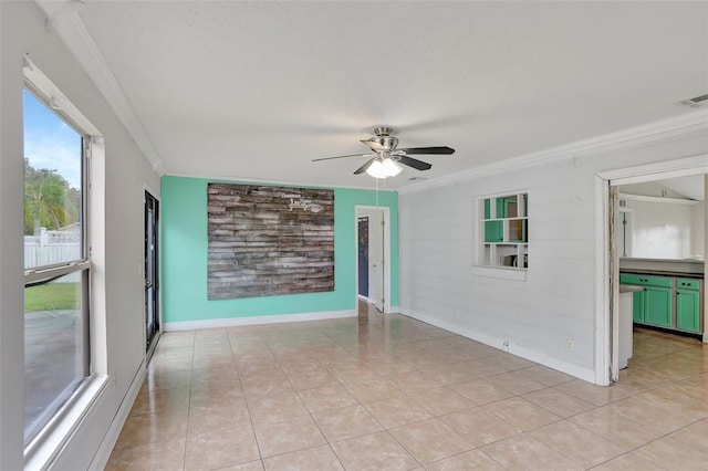 1053 E Hancock Dr, Deltona, FL 32725 - unfurnished room with ornamental molding, a ceiling fan, and light tile patterned floors