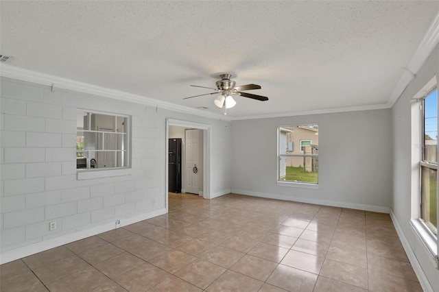 1053 E Hancock Dr, Deltona, FL 32725 - empty room featuring a textured ceiling, ornamental molding, ceiling fan, and tile patterned flooring
