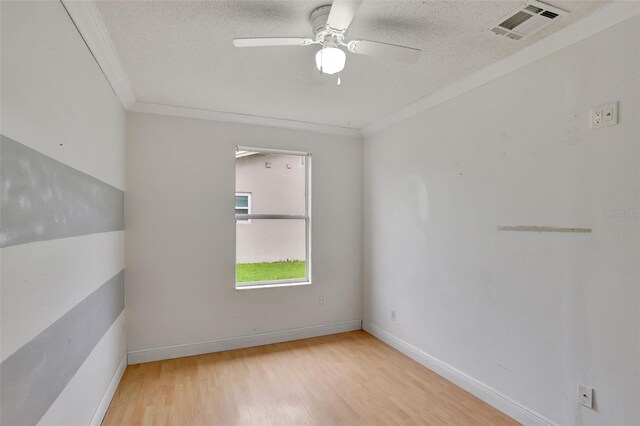 1053 E Hancock Dr, Deltona, FL 32725 - unfurnished room featuring crown molding, wood finished floors, a textured ceiling, and ceiling fan