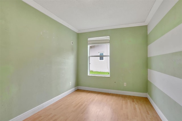 1053 E Hancock Dr, Deltona, FL 32725 - spare room with light wood finished floors and ornamental molding