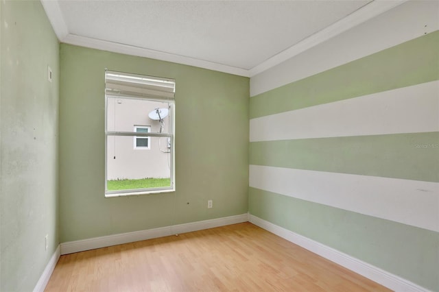 1053 E Hancock Dr, Deltona, FL 32725 - empty room with wood finished floors and ornamental molding