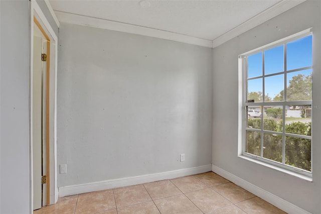 1053 E Hancock Dr, Deltona, FL 32725 - spare room with healthy amount of natural light, light tile patterned floors, and ornamental molding