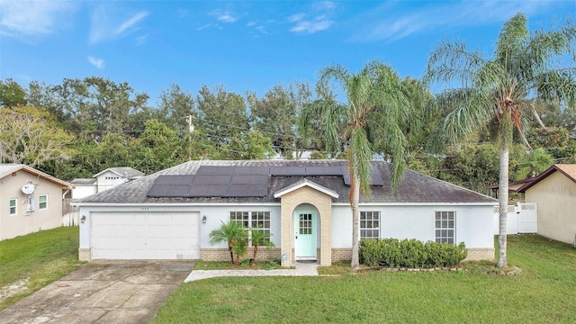 1053 E Hancock Dr, Deltona, FL 32725 - single story home with brick siding, roof with shingles, and a garage