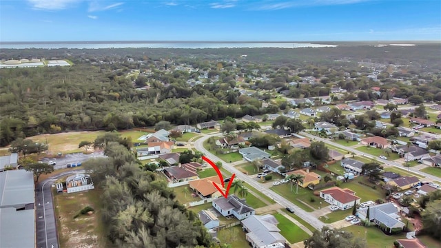 1053 E Hancock Dr, Deltona, FL 32725 - aerial overview of property's location with nearby suburban area and a nearby body of water