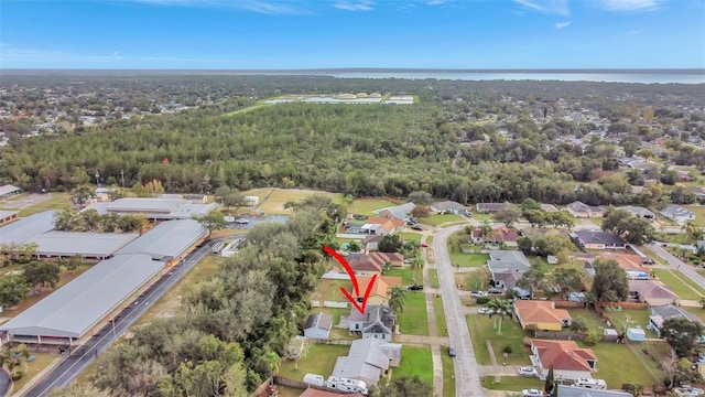 1053 E Hancock Dr, Deltona, FL 32725 - aerial overview of property's location featuring a forest and nearby suburban area