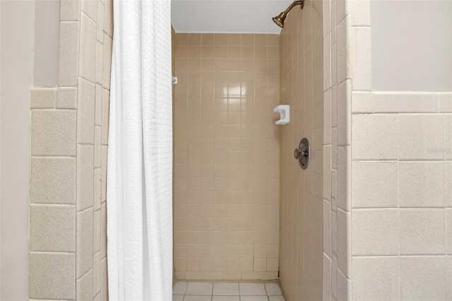 bathroom with tile patterned flooring and a shower with shower curtain