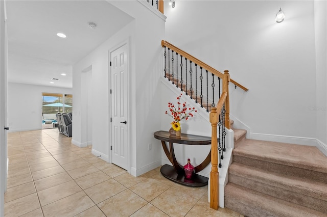 stairs with tile patterned flooring