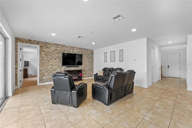 tiled living room with a fireplace