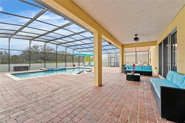 view of swimming pool featuring an outdoor hangout area, a patio area, a lanai, and ceiling fan