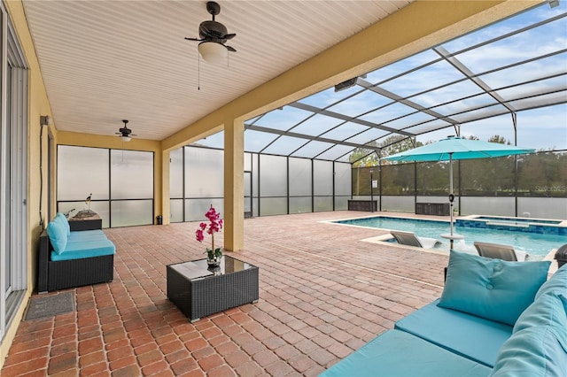 view of swimming pool featuring a lanai, ceiling fan, an outdoor living space, and a patio area