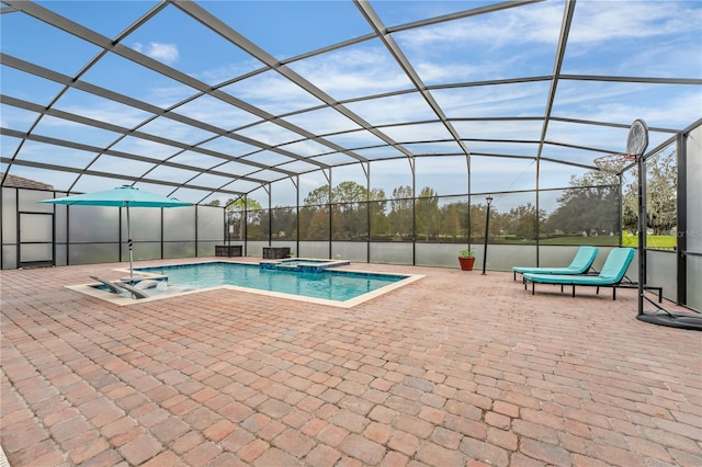 view of swimming pool with a lanai, an in ground hot tub, and a patio area