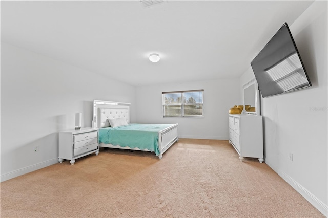 bedroom featuring light colored carpet