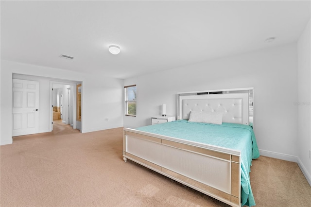 bedroom featuring light colored carpet