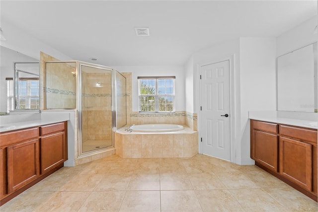 bathroom featuring vanity, tile patterned floors, and plus walk in shower