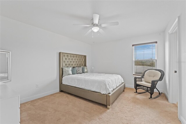 bedroom featuring ceiling fan and light colored carpet