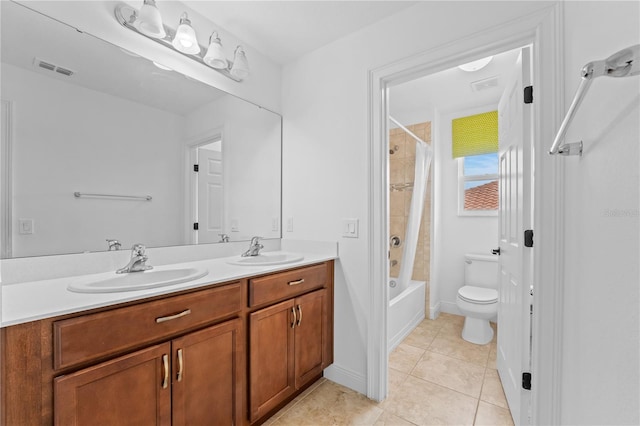 full bathroom featuring vanity, shower / tub combo with curtain, tile patterned flooring, and toilet