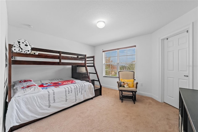 bedroom featuring light colored carpet