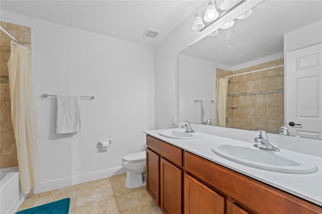 full bathroom with vanity, shower / tub combo with curtain, tile patterned floors, and toilet