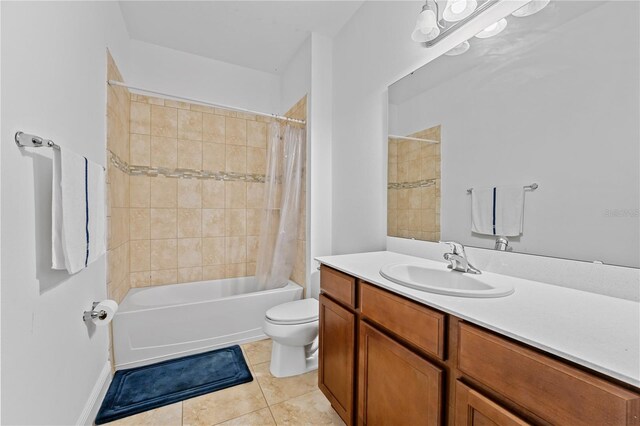 full bathroom featuring toilet, shower / tub combo with curtain, vanity, and tile patterned flooring