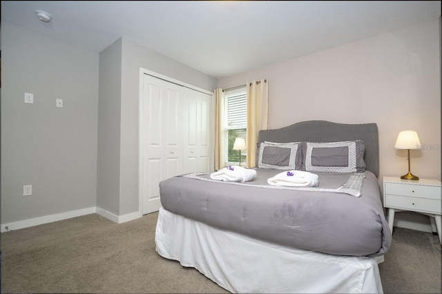 carpeted bedroom featuring a closet