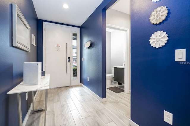 foyer with light wood-type flooring