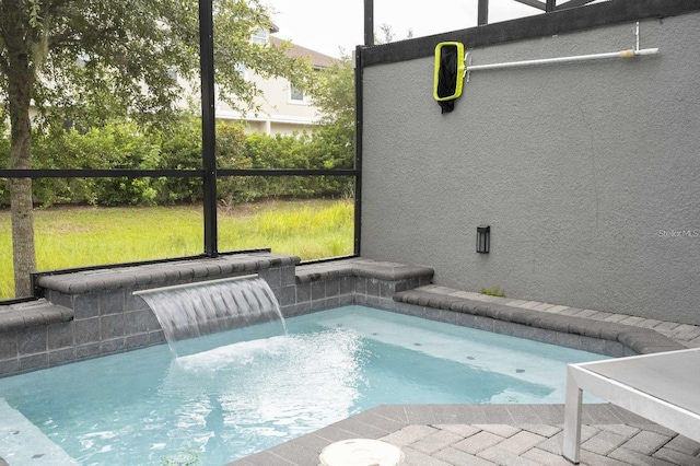 view of swimming pool with pool water feature