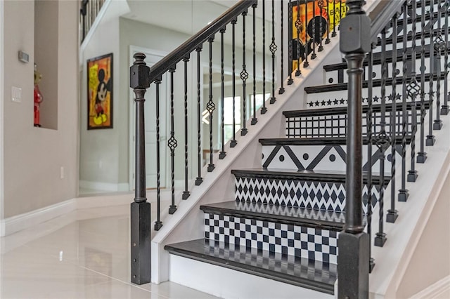 staircase with tile patterned flooring