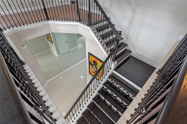 stairs with tile patterned flooring