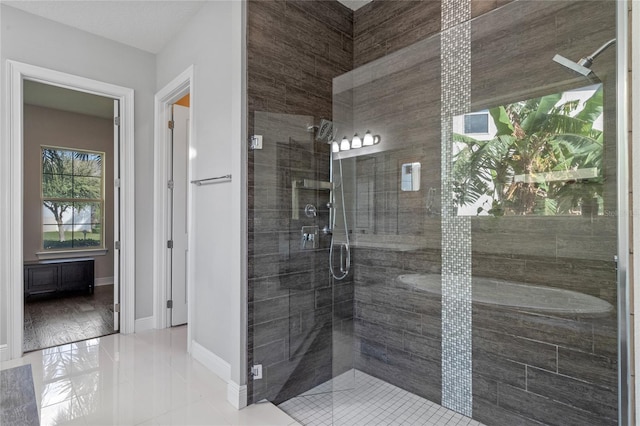 bathroom with a shower with door