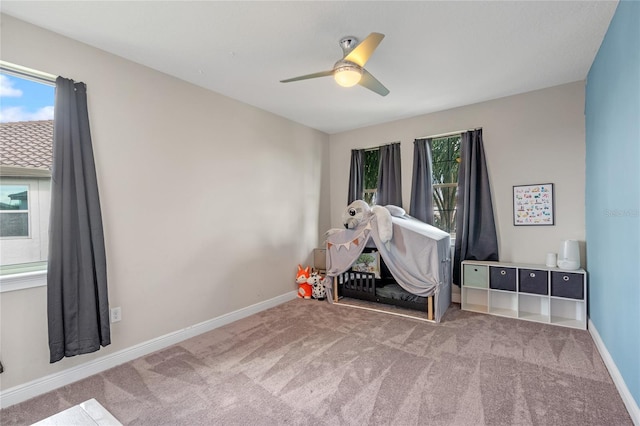 miscellaneous room featuring ceiling fan and carpet floors