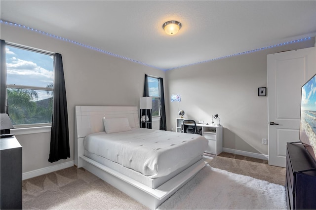 bedroom with light carpet