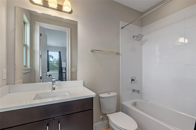 full bathroom with vanity, toilet, and tiled shower / bath combo