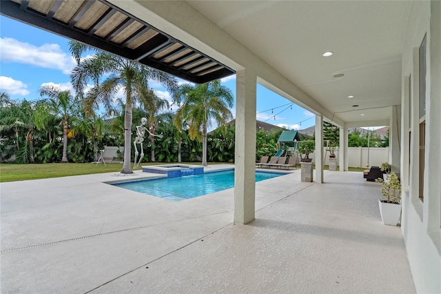 view of pool featuring a patio area, a playground, and an in ground hot tub