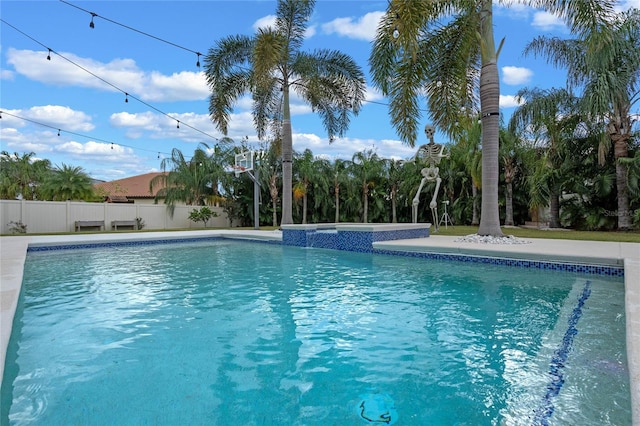 view of pool with an in ground hot tub