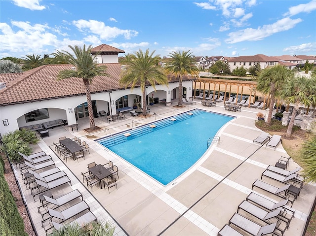 view of swimming pool featuring a patio area