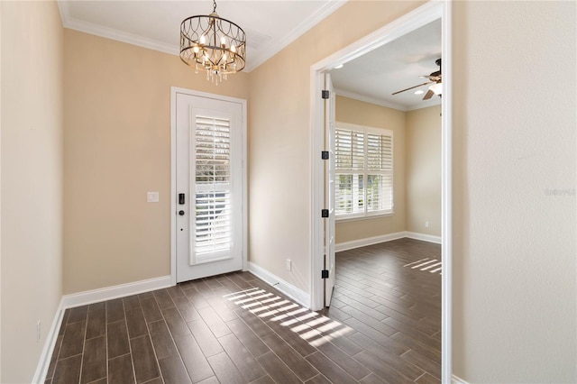 entrance foyer featuring ceiling fan with notable chandelier and crown molding