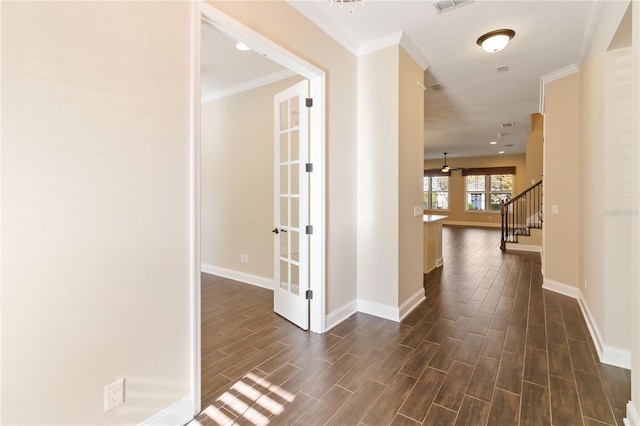 hallway featuring crown molding