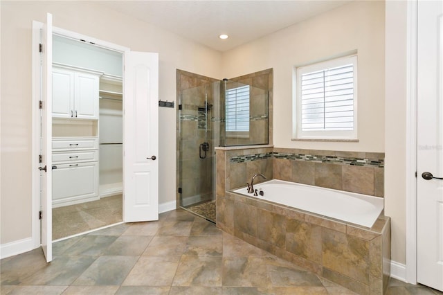 bathroom with shower with separate bathtub