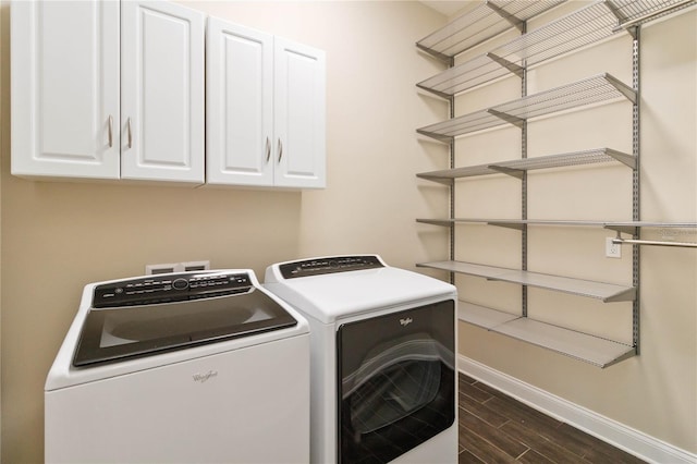 washroom with cabinets and independent washer and dryer