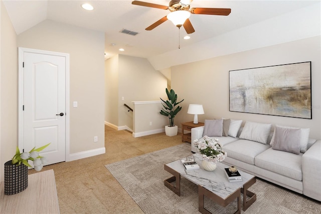 living room with light carpet, ceiling fan, and vaulted ceiling