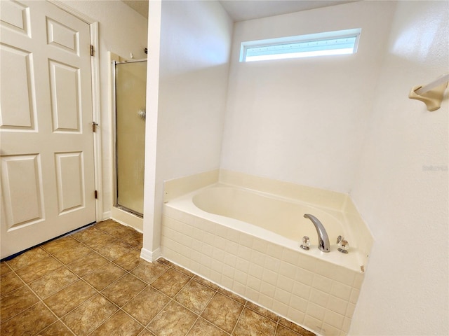 bathroom with tile patterned flooring and plus walk in shower