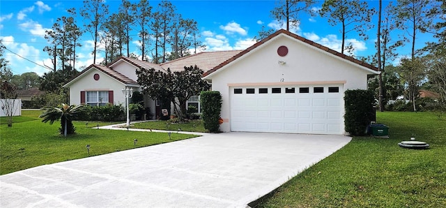 ranch-style house featuring a garage and a front yard